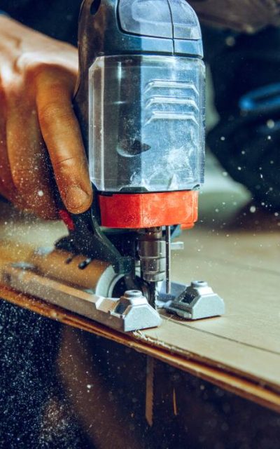 carpenter-using-circular-saw-cutting-wooden-boards-construction-details-male-worker-handy-man-with-power-tools (1)